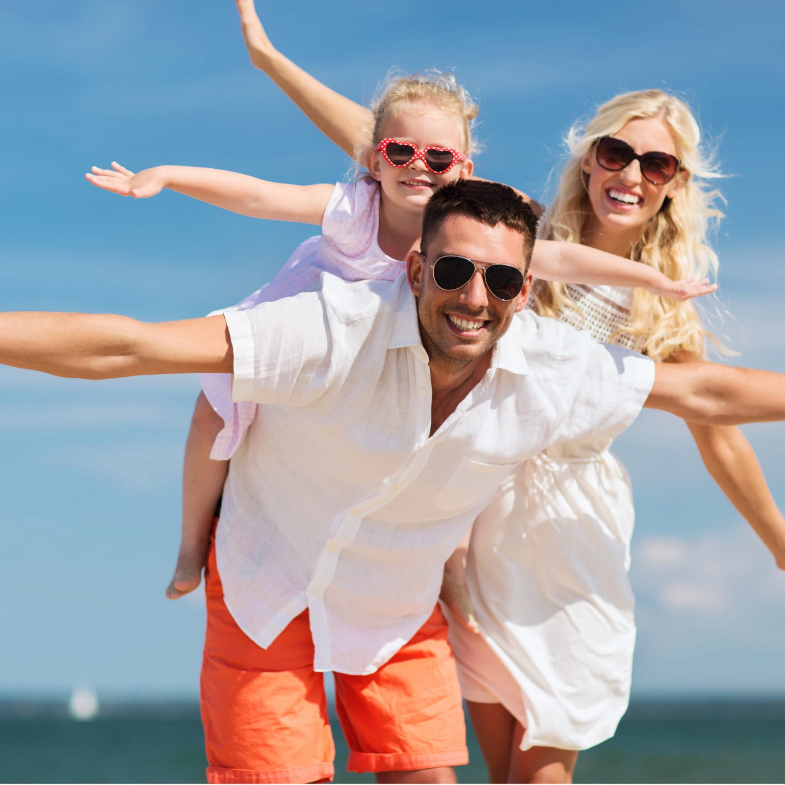 Happy family enjoying a beach vacation in Playa del Carmen, Riviera Maya